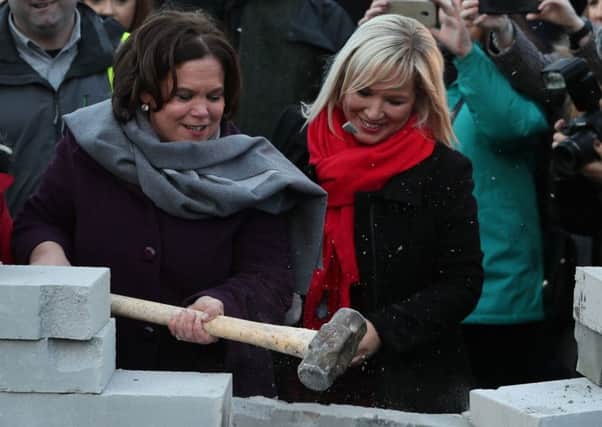 Sinn Fein leader Mary Lou McDonald (left) and deputy leader Michelle O'Neill (right) knock down a symbolic wall that was built as part of an anti-Brexit rally at the Irish border at Co Louth on Saturday January 26, 2019. Days before in Soloheadbeg Ms McDonald spoke of the need to honour "finish the journey, where Tipperary leads Ireland will follow. Tiocháidh ár lá."
Photo: Brian Lawless/PA Wire