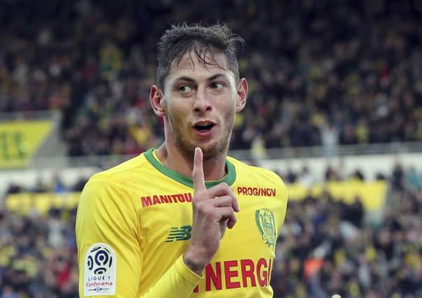 Argentine soccer player, Emiliano Sala, of the FC Nantes club, western France, reacts after scoring during a soccer match against Guingam, in Nantes, France. The French civil aviation authority says Emiliano Sala was aboard a small passenger plane that went missing off the coast of the island of Guernsey. (AP Photo/David Vincent)