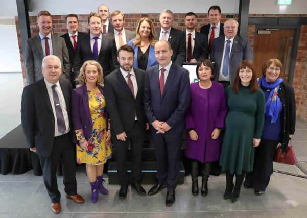 The SDLP's Colum Eastwood MLA and Fianna Fail's Micheal Martin TD  together with members of the two parties at the partnership launch in Belfast. Pic by PressEye