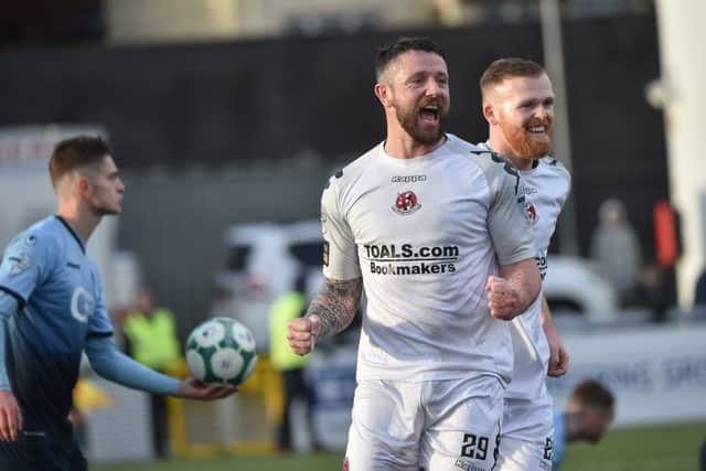 Crusaders Rory Patterson celebrates after scoring at Institute, on Saturday.