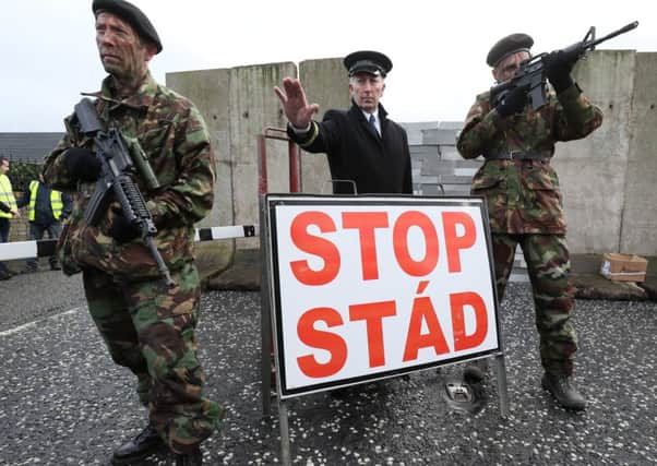 A mock checkpoint manned by actors dressed as soldiers and customs officers constructed during an anti-Brexit rally at the Irish border near Carrickcarnan, Co Louth.