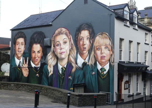 A mural of the 'Derry Girls' on the wall of Badger's Bar in the city's Orchard Street. 
Photo: Lorcan Doherty/Press Eye
