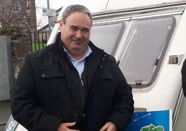 Sinn Fein MLA Colum Eastwood beside the caravan he used for a political clinic in Moy on Saturday 26 January.