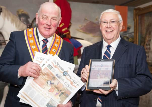 Grand Master Edward Stevenson (left) and Tom Haire, chairman of  the Orange Standard committee, show off the loyal order's new-look newspaper which was launched at Schomberg House yesterday