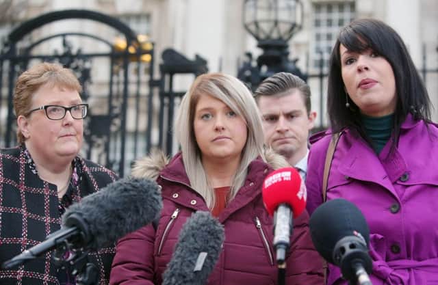 Sarah Ewart (centre), her mother Jane Christie (left) and Grainne Teggart from Amnesty International arrive at the High Court in Belfast. Picture by Jonathan Porter/PressEye