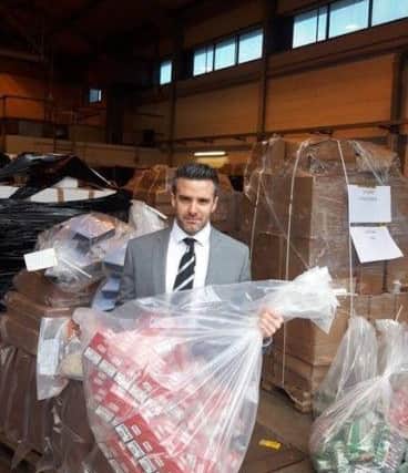 Detective Superintendent Bobby Singleton pictured with some of the seized items.