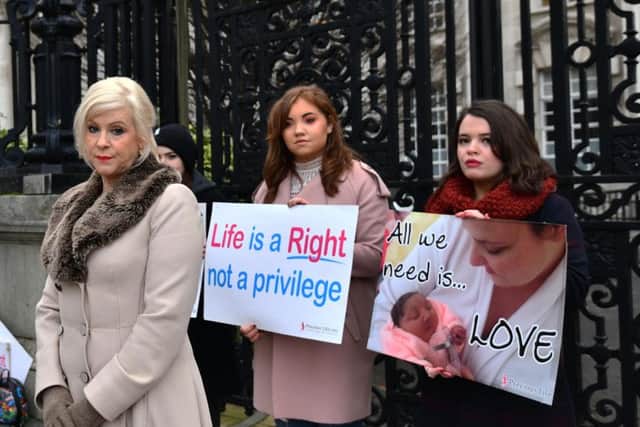 Bernadette Smyth (left), founder and director of Precious Life, with fellow pro-life campaigners at Belfast High Court this morning. Pic by Pacemaker