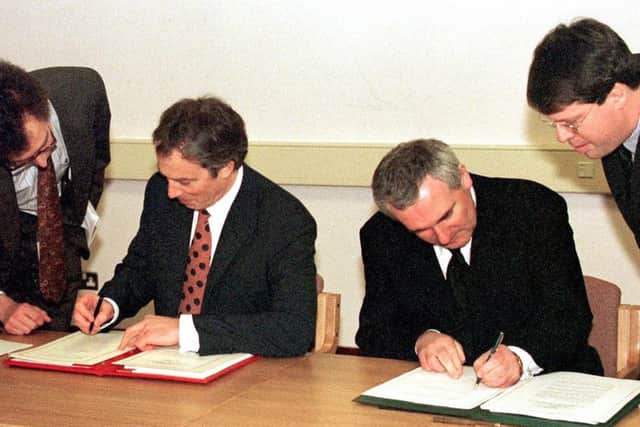 Tony Blair (left) and Bertie Ahern sign the Good Friday Agreement in April 1998