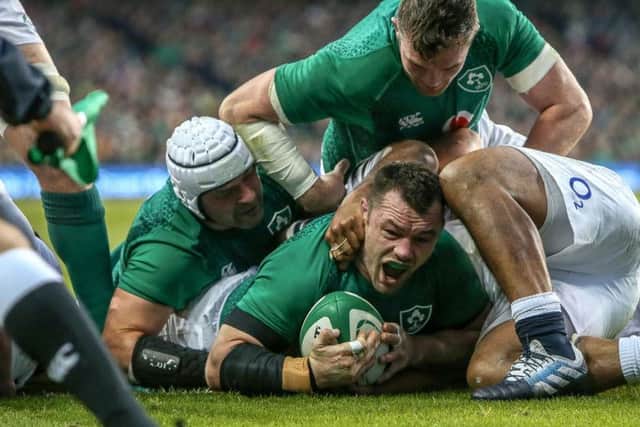 Ireland's Cian Healy scores a try against England