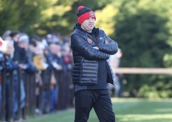 Larne Tech Old Boys boss Johnny Hastings on the sideline