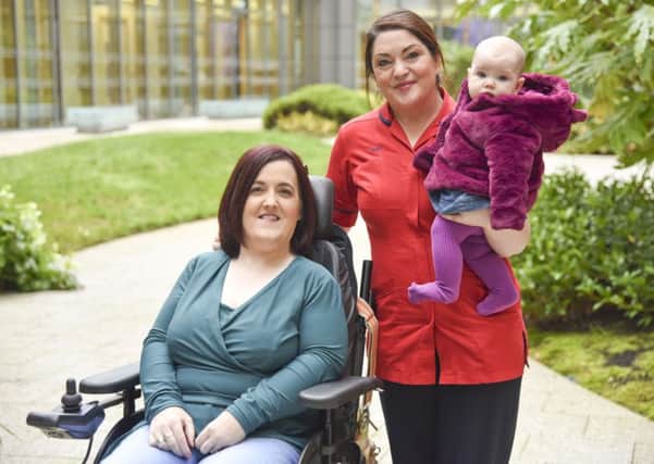 Mum Sarah Griffiths is pictured with midwife of the year Brenda McCabe and baby Daisy