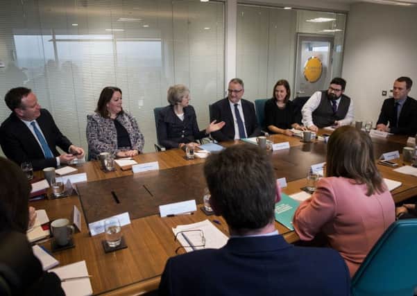 Prime Minister May pictured meeting key business leaders after her speech on Tuesday afternoon