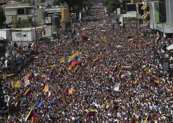 Anti-government protestors take part in a nationwide demonstration demanding the resignation of President Nicolas Maduro, in Caracas, Venezuela on Saturday