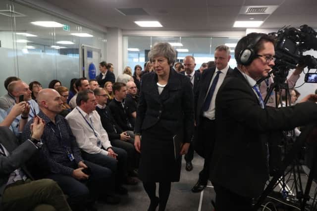 Prime Minister Theresa May leaves after speaking with business representatives about Brexit and takinng questions from the media at Allstate in Belfast. Photo: Liam McBurney/PA Wire