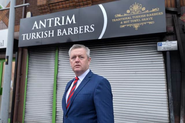 Mayor of Antrim and Newtownabbey Paul Michael visits the scene as  a fire at a Turkish barbers in Antrim is being investigated by police as suspected arson. 
TThe blaze is believed to have taken hold between 7.30pm and 8pm on Monday at the premises on High Street.
