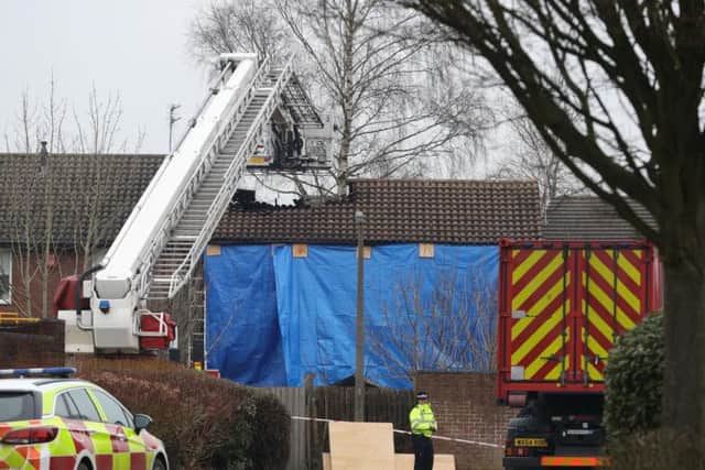Firefighters at the scene of a house fire in Sycamore Lane, Stafford,