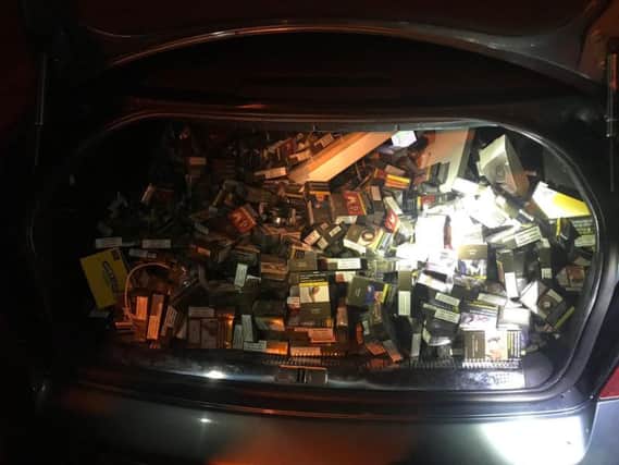 Garda undated handout photo of a large quantity of cigarettes along with phones, sim cards and other property were recovered from a car by gardai investigating a number of overnight burglaries at business premises in counties Wicklow and Wexford
