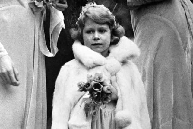 Princess Elizabeth arriving at the 16th century church at Balcombe, Sussex, for the wedding of Lady May Cambridge and Captain Henry Abel Smith.