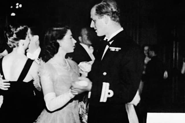 Princess Elizabeth dancing with her fiance, Lieutenant Philip Mountbatten, RN, at the Assembly Rooms, Edinburgh, when a ball was held to welcome the royal family to Scotland.