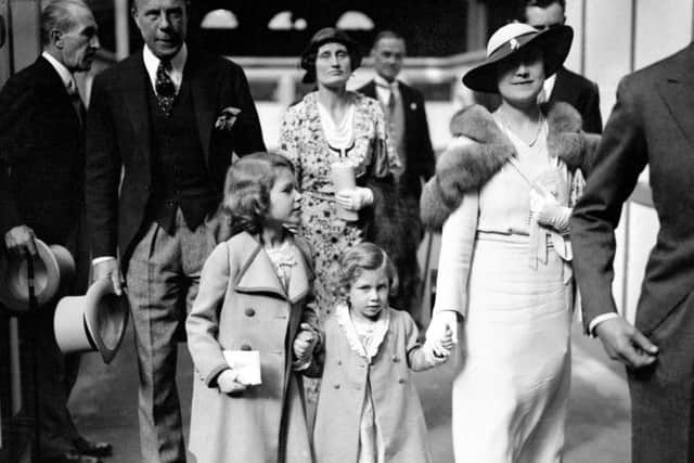 The Duchess of York, with Princess Elizabeth and Princess Margaret, arriving at Olympia for the International Horse show.