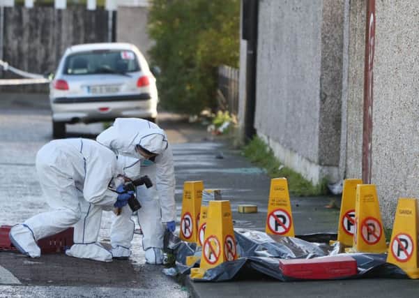 Forensic investigators at the scene in Marigold Crescent in the Darndale, Dublin after a man was shot dead on Friday