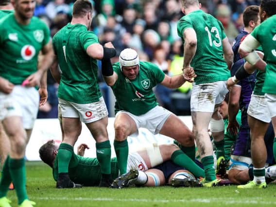 Ireland's Rory Best getting a help hand from his team mates