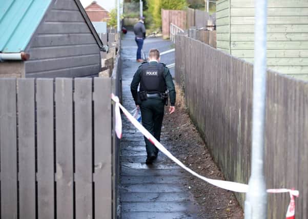Police at the scene in Clogher, Co Tyrone, where the body of Pat Ward was found on Saturday