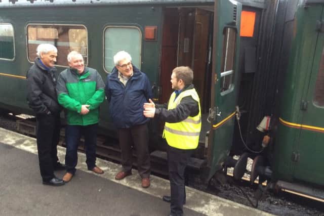 Matthew Wilson at work as a volunteer tour guide at Whitehead Railway Museum.