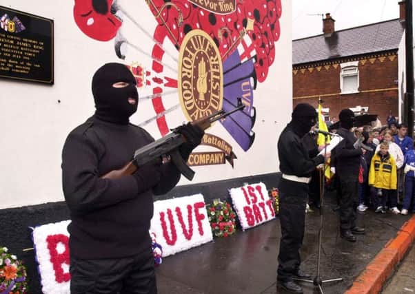 July 2000: Members of the UVF (which killed over 500 people during the Troubles) on the Shankill Road