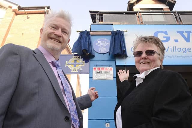 Tim Murrary and Julie Burgess unveil the blue plaque which honours their late mother. 
Pic by Arthur Allison.
