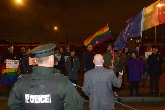 Watched by a policeman, John ODoherty addresses the small band of LGBT protestors. Photo: Pacemaker Arthur Allison.