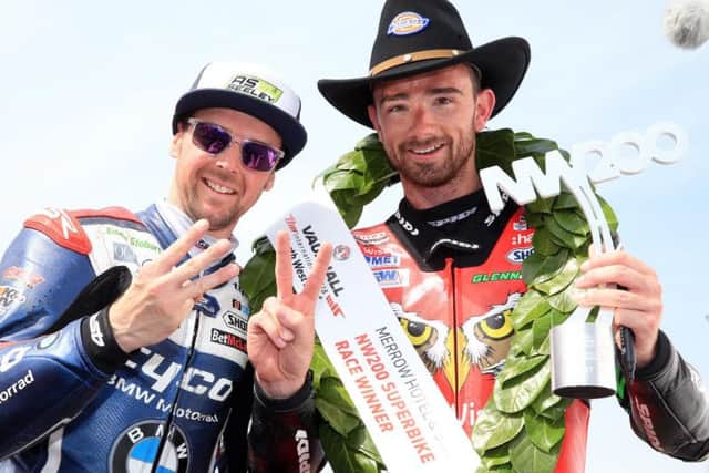 Alastair Seeley (left) and Glenn Irwin toast their success at last year's North West 200.