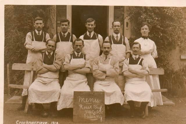 Eight men and one woman in aprons at Crocknacrive