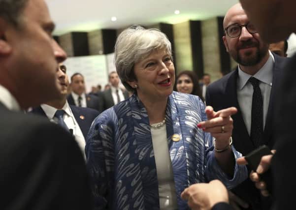 Theresa May, centre, speaks with Luxembourg's Prime Minister Xavier Bettel, left, and Dutch Prime Minister Mark Rutte, right, at an EU-Arab summit at Sharm El Sheikh, Egypt, on Sunday, Feb 24. David McNarry says: "She should sack dissident ministers or else she will become a prisoner of the remainers" (AP Photo/Francisco Seco)