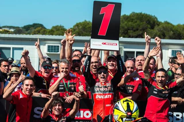 Hat-trick hero Alvaro Bautista celebrates with his Aruba.it Ducati team at Phillip Island.