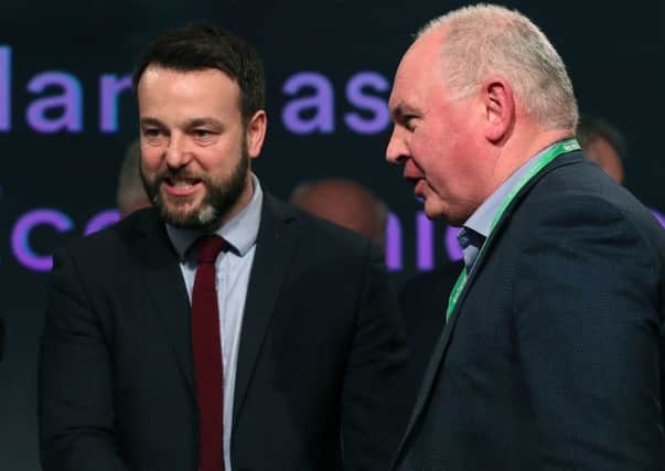 SDLP leader Colum Eastwood (left) at the Fianna Fail annual conference at the Citywest Hotel in Dublin on Saturday