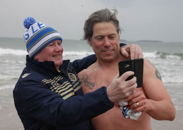 Comedian John Bishop and Thomas Crowe  joined the Arcadia Bathing clun in Portrush on Saturday morning as he took to the sea.PICTURE KEVIN MCAULEY/MCAULEY MULTIMEDIA