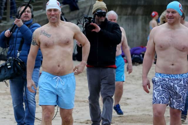 Comedian John Bishop joined Stephen McConnell the Arcadia Bathing clun in Portrush on Saturday morning as he took to the sea.PICTURE KEVIN MCAULEY/MCAULEY MULTIMEDIA