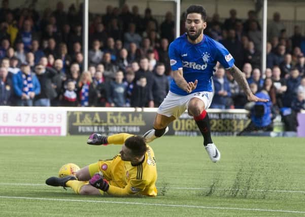 Rangers Daniel Candeias is tackled by Hamilton keeper Gary Woods