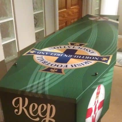 A coffin designed with a Northern Ireland fan in mind