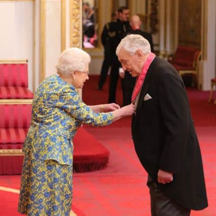 Irish rugby great Willie John McBride receives a CBE for services to Rugby Union from Queen Elizabeth II during an investiture ceremony at Buckingham Palace. Photo: Dominic Lipinski/PA Wire