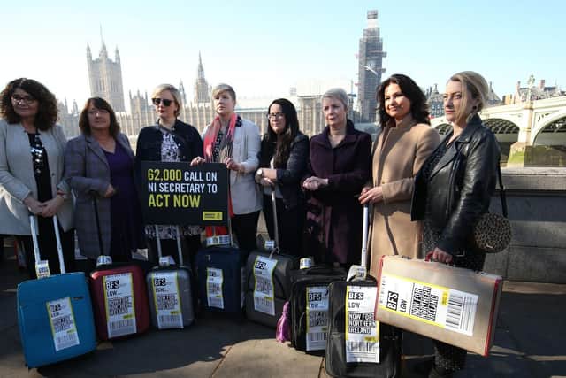 Heidi Allen (second right) joins women impacted by Northern Ireland's strict abortion laws who are carrying suitcases, symbolising the women who travel from Northern Ireland to Great Britain for terminations, across Westminster Bridge demanding legislative change.