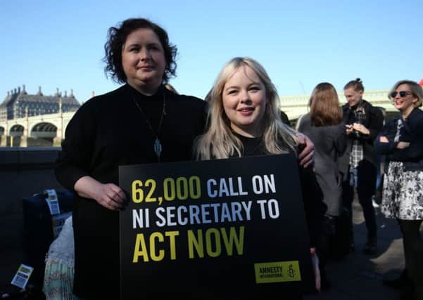 Derry Girls cast members Siobhan McSweeney and Nicola Coughlan (right) join MPS and women impacted by Northern Ireland's abortion laws on Westminster Bridge in London to demand legislative change