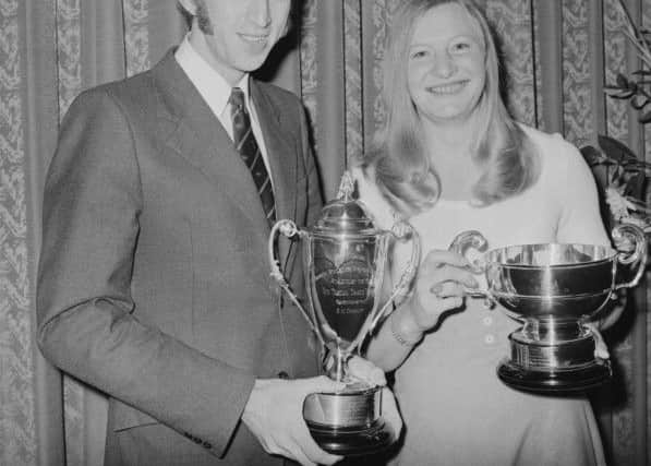 British track and field athletes David Hemery and Mary Peters with trophies awarded by the British Athletics Writers Association, UK, 29th October 1972. (Photo by Steve Wood/Daily Express/Hulton Archive/Getty Images)