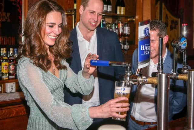The Duchess of Cambridge shows her pulling power, pouring a pint of Harp Ice, at the Empire Music Hall. Pic Matt Mackey, Press Eye