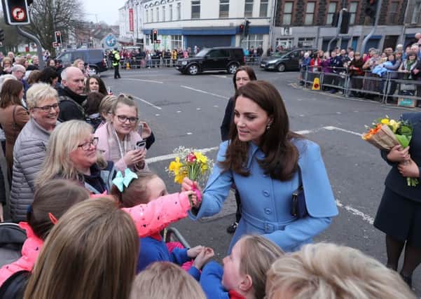The Duchess of Cambridge receives flowers during a walkabout outside the Braid Arts Centre in Ballymena as part of their two day tour to Northern Ireland. PRESS ASSOCIATION Photo. Picture date: Thursday February 28, 2019. See PA story ROYAL Cambridge. Photo credit should read: Niall Carson/PA Wire