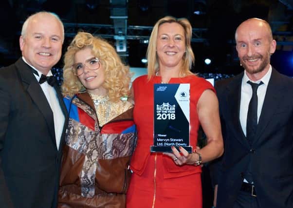Stephen Stewart receives the award from Paloma Faith with colleague Karen Bickerstaff, operations director and Skoda UK director Rod McLeod