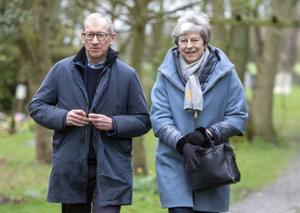 Prime Minister Theresa May leaves with her husband Philip after attending a church service near her Maidenhead constituency.