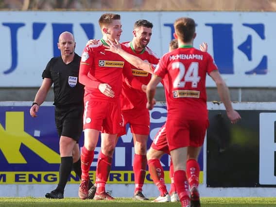Ryan Curran (left) celebrates after scoring Cliftonville's second goal on Saturday.