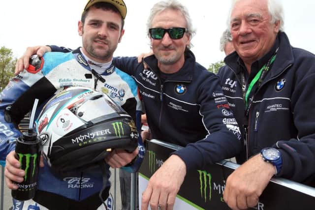 Ballymoney man Michael Dunlop with Tyco BMW team owners Philip and Hector Neill after he won the Superbike TT in 2018.